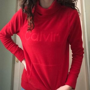 RED CALVIN KLEIN MOCKNECK SIZE S WITH FRONT POCKET DETAIL